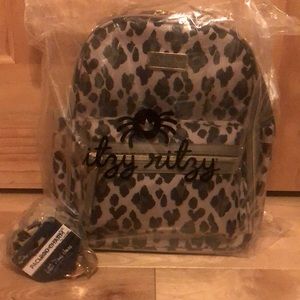 Itzy ritzy diaper bag and pacifier pod charm